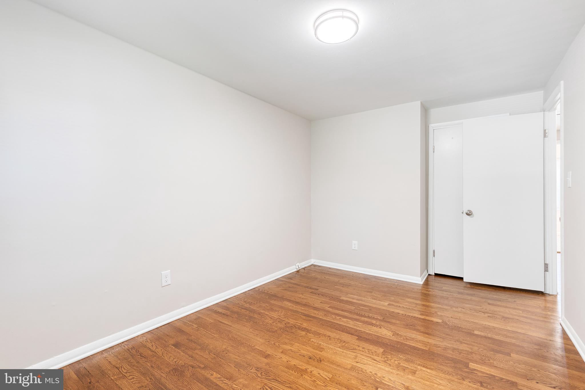 5649 Utrecht Road Baltimore, MD 21206 - Photo 29 of 42 a view of empty room with wooden floor