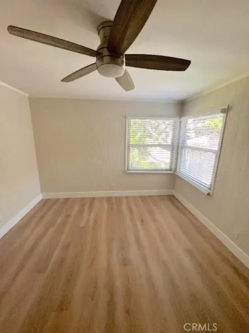 a view of an empty room and a window