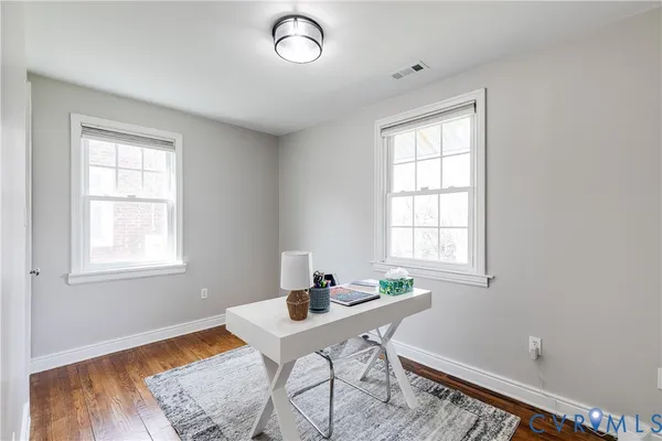 a workspace with furniture and window