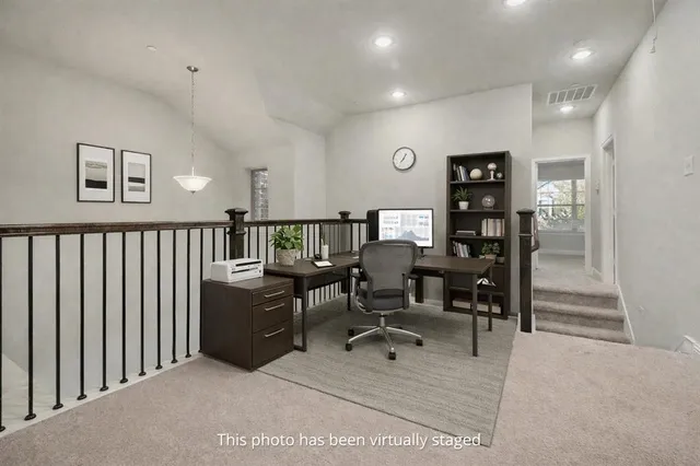 a view of a workspace with furniture