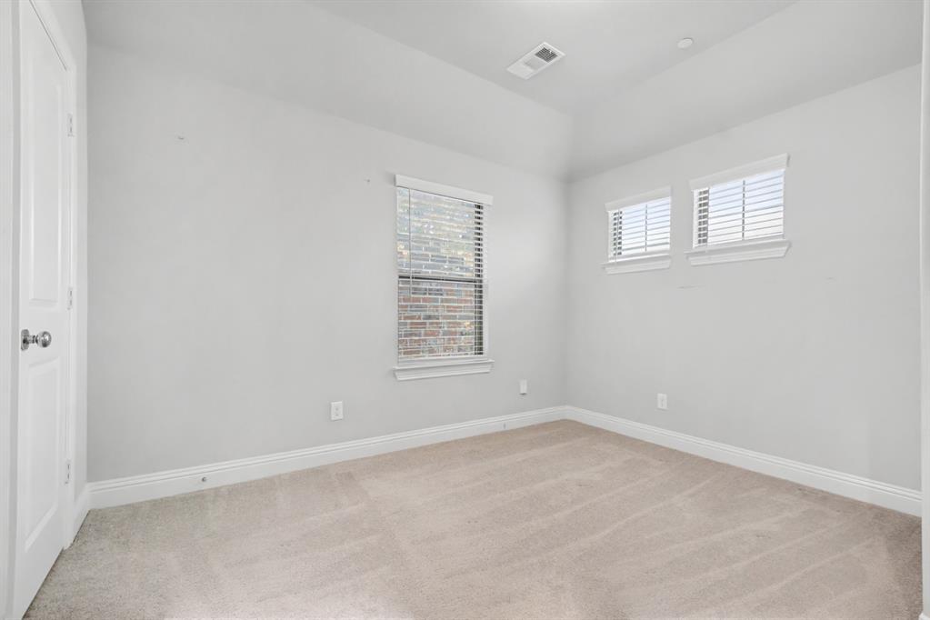 520 Teton Street Allen, TX 75002 - Photo 18 of 26 an empty room with windows