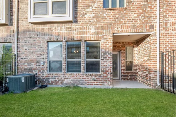 a view of front door of house with yard