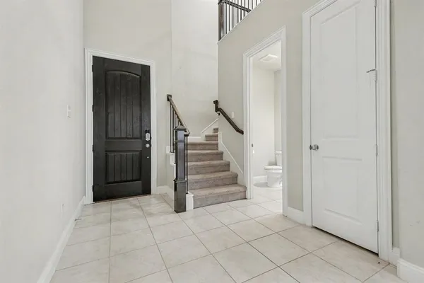 an entryway in a hall with a cabinet