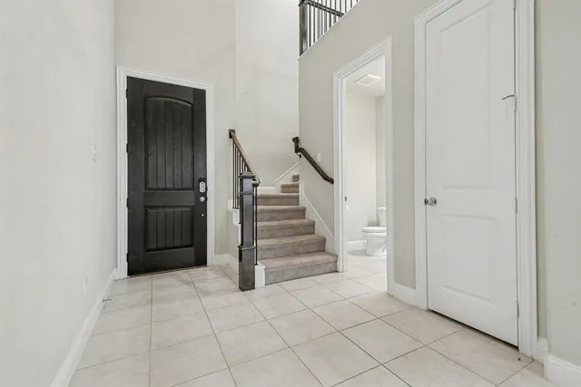 an entryway in a hall with a cabinet