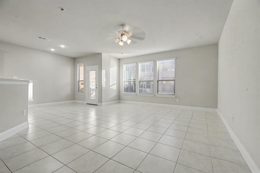 520 Teton Street Allen, TX 75002 - Photo 4 of 26 a view of an empty room with a window