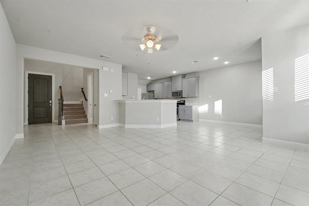 520 Teton Street Allen, TX 75002 - Photo 5 of 26 a view of a kitchen with a sink and a refrigerator