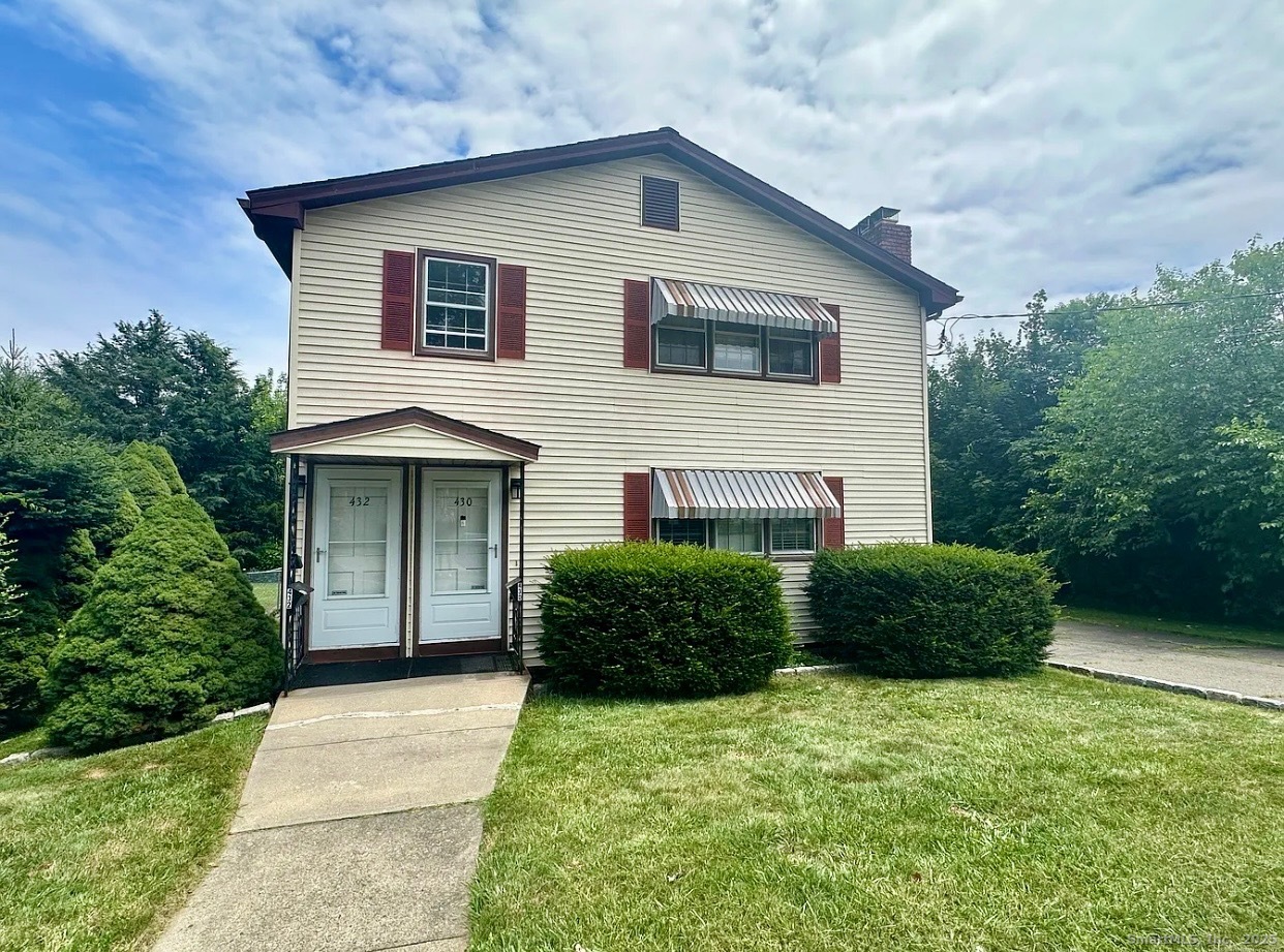 432 Wiklund Avenue Stratford, CT 06614 - Photo 2 of 19 a front view of a house with a yard