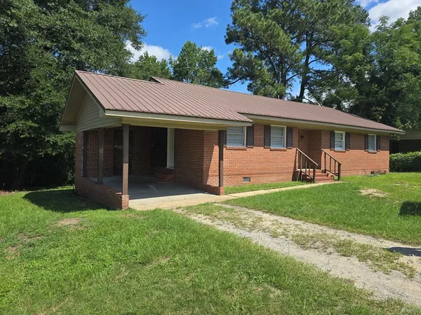 front view of a house with a yard