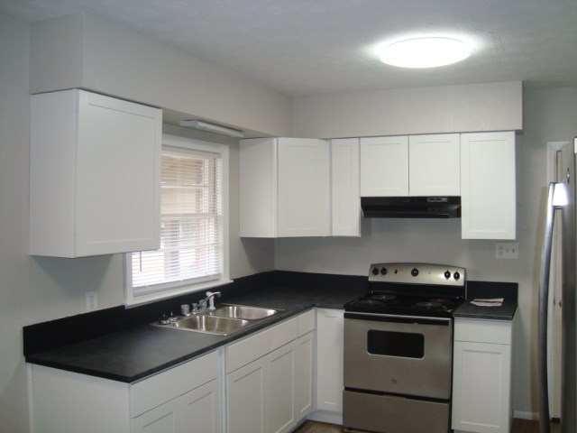 804 Goodson Drive Columbus, GA 31907 - Photo 2 of 21 a kitchen with a sink stove and microwave