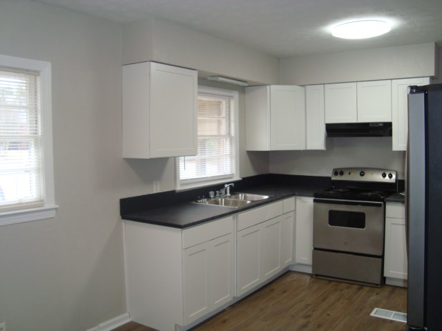 804 Goodson Drive Columbus, GA 31907 - Photo 3 of 21 a kitchen with a sink stove and cabinets