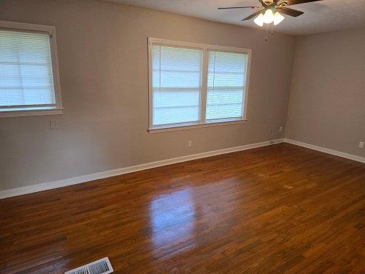 804 Goodson Drive Columbus, GA 31907 - Photo 10 of 21 an empty room with wooden floor and windows