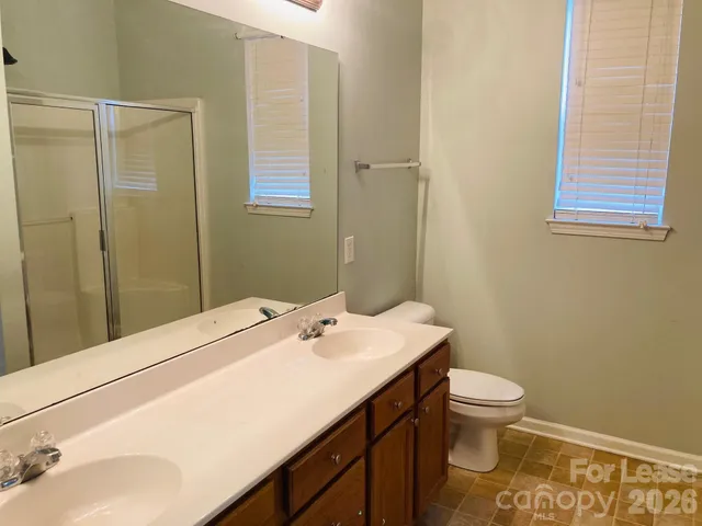 a bathroom with a sink toilet and vanity