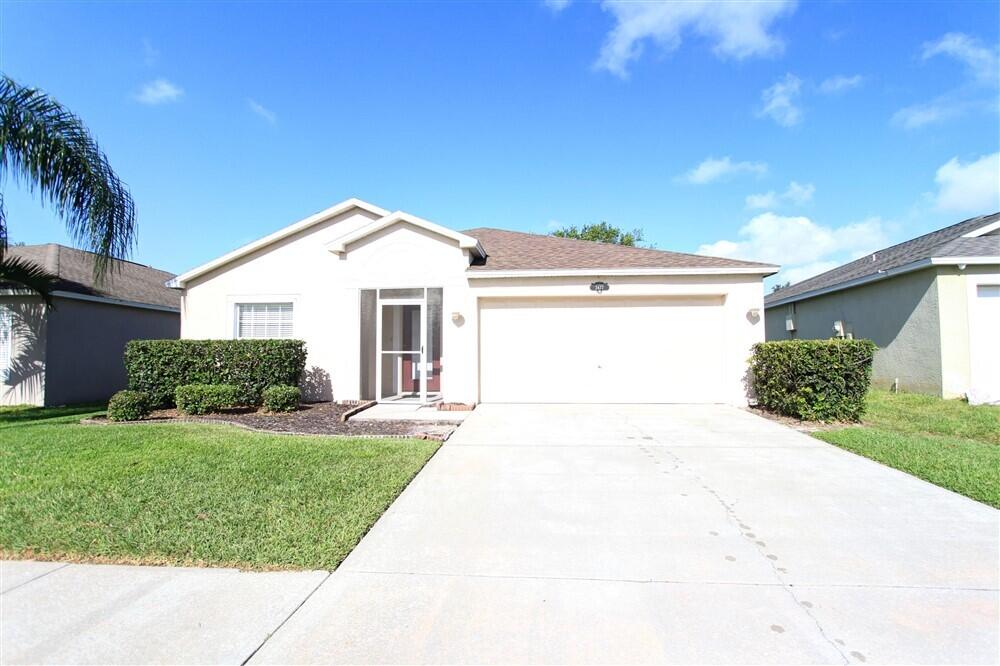 2477 Deercroft Drive Melbourne, FL 32940 - Photo 2 of 30 a front view of a house with a yard
