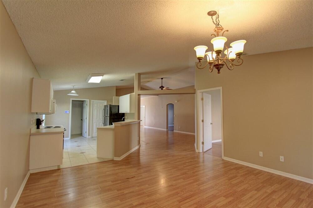 2477 Deercroft Drive Melbourne, FL 32940 - Photo 21 of 30 a view of a kitchen with a sink and refrigerator
