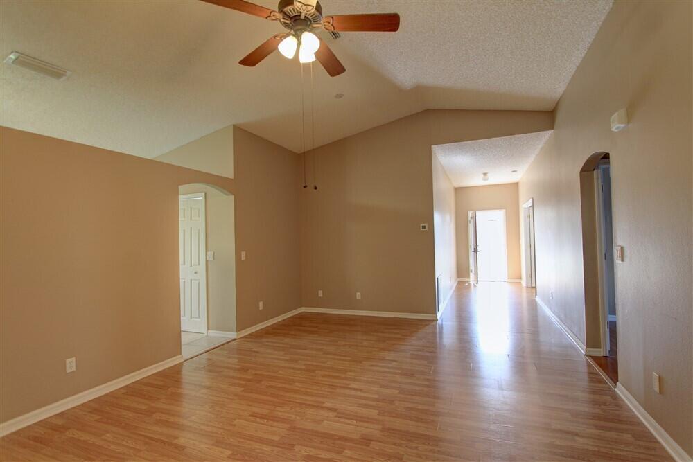 2477 Deercroft Drive Melbourne, FL 32940 - Photo 26 of 30 a view of an empty room and wooden floor