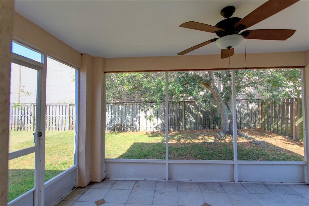 2477 Deercroft Drive Melbourne, FL 32940 - Photo 27 of 30 a view of an empty room and floor to ceiling window
