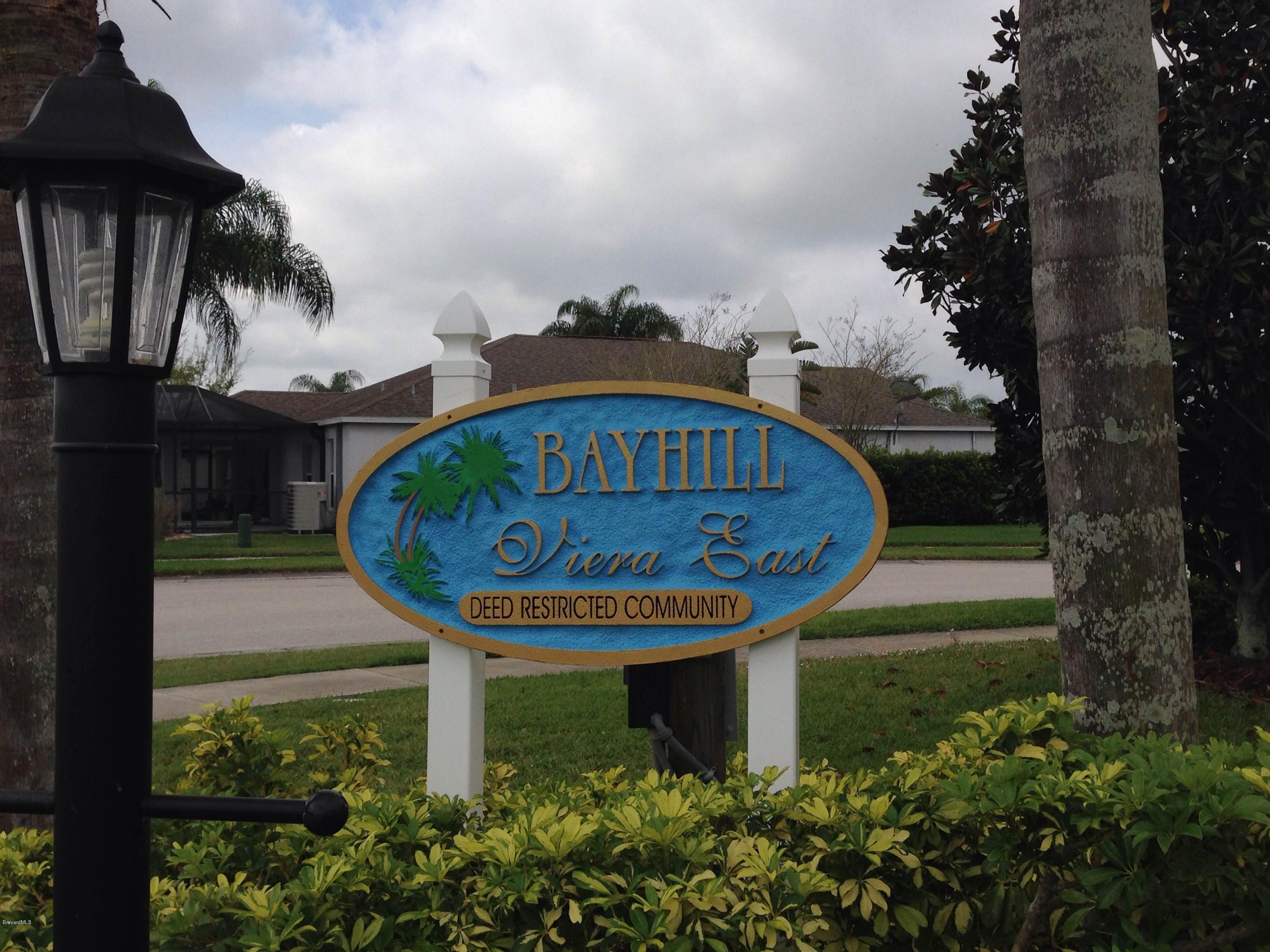 2477 Deercroft Drive Melbourne, FL 32940 - Photo 10 of 30 a view of a back yard of the house along with garden and retail shops