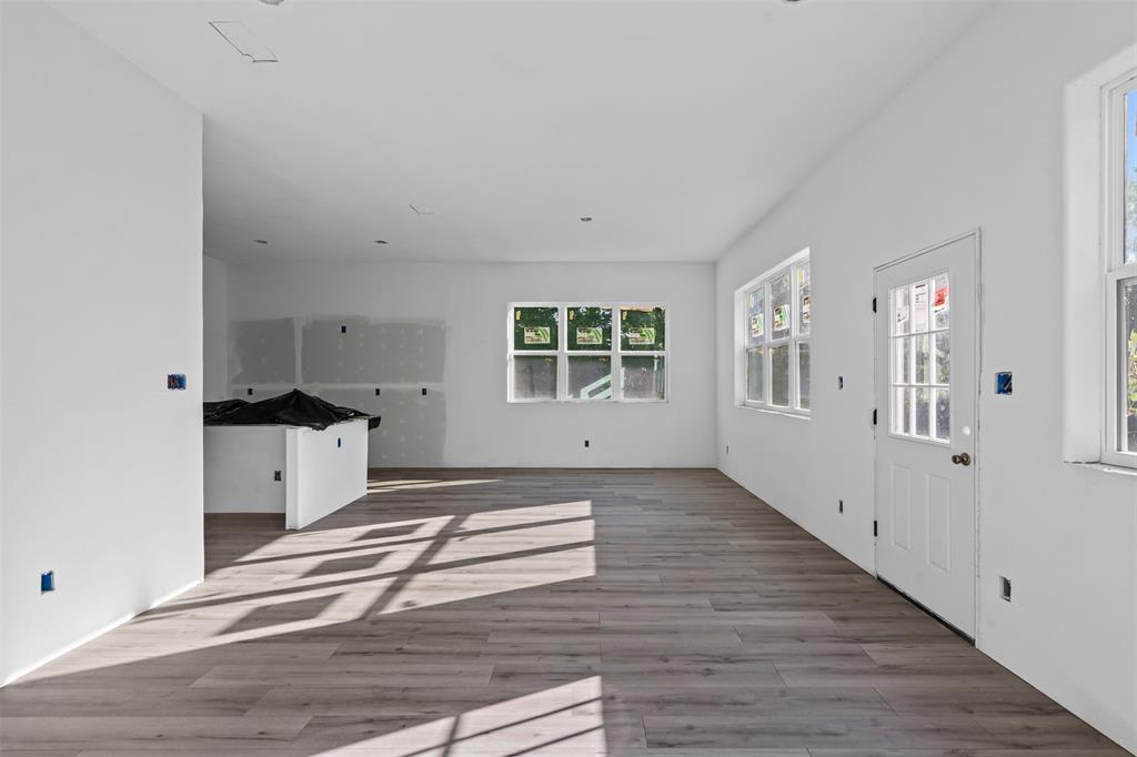 308 North McGraw Street Forney, TX 75126 - Photo 16 of 26 Unfurnished living room with wood finished floors