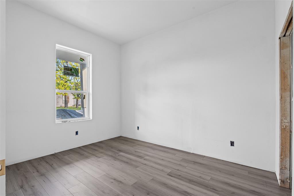 308 North McGraw Street Forney, TX 75126 - Photo 7 of 26 Spare room with wood finished floors