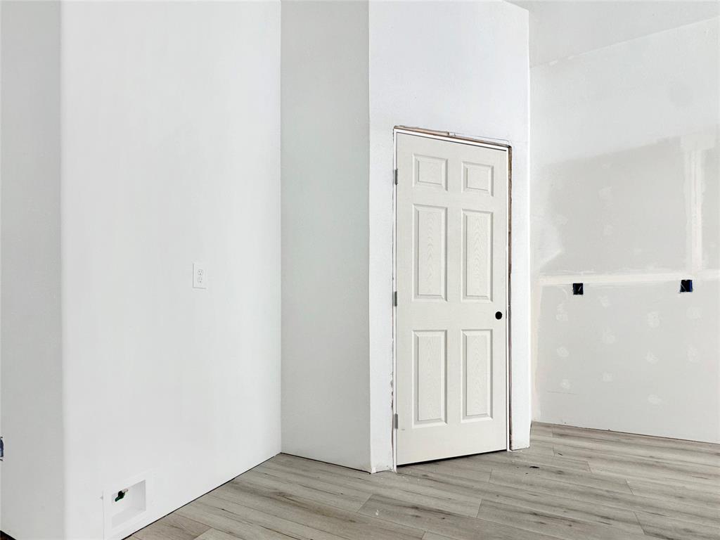 308 North McGraw Street Forney, TX 75126 - Photo 8 of 26 Spare room featuring light wood-type flooring