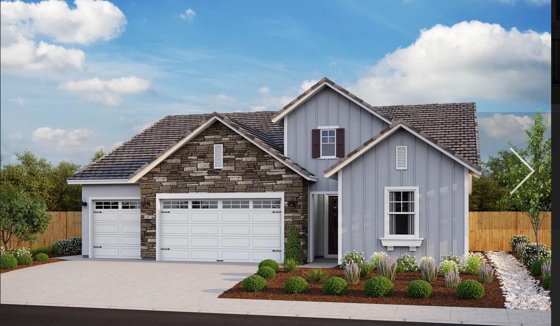 a view of a house with a yard and plants