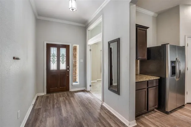 a kitchen with a refrigerator and a sink
