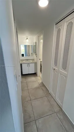 a bathroom with a sink and mirror