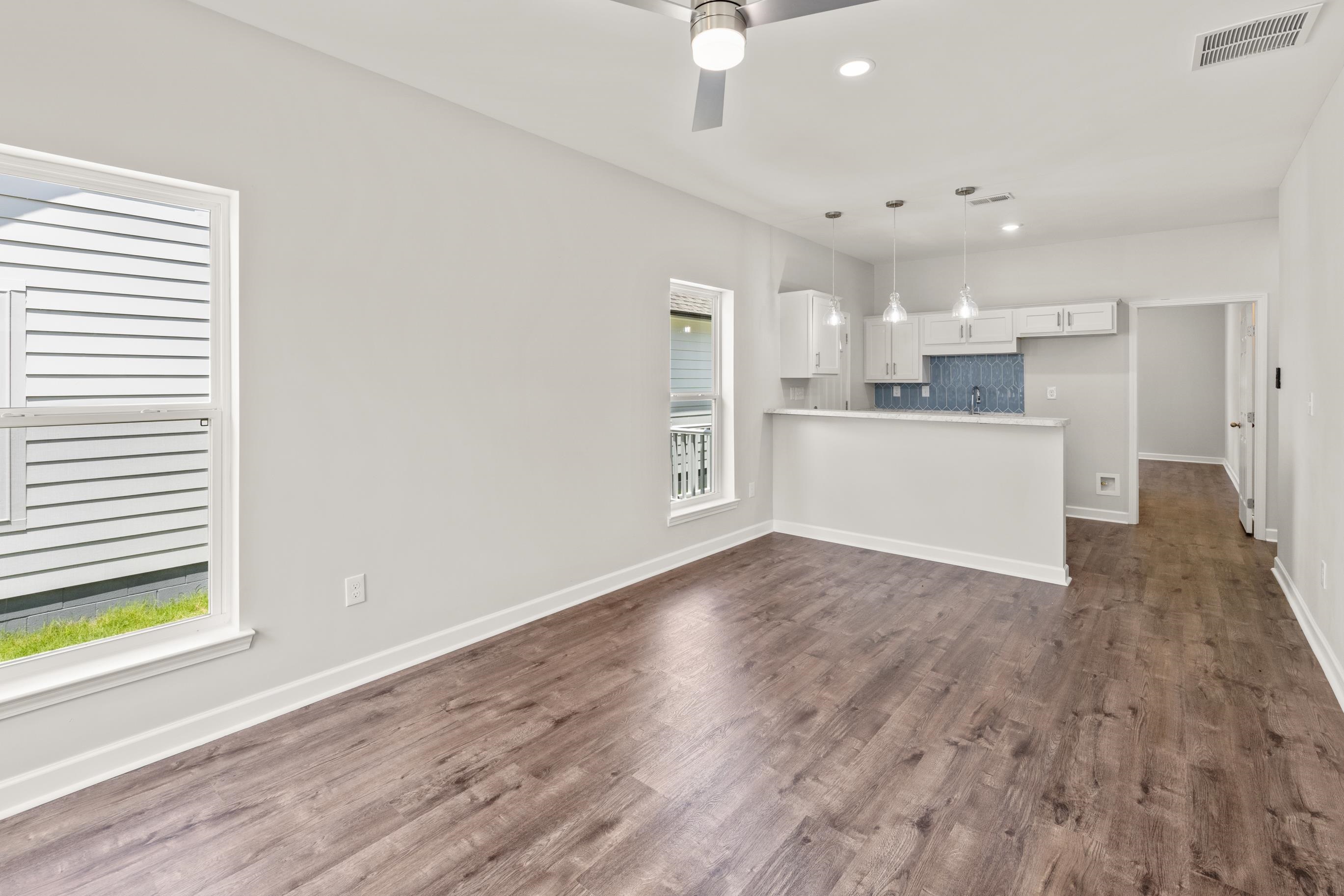 828 Semmes Street Memphis, TN 38111 - Photo 10 of 18 a view of a kitchen with wooden floor and electronic appliances