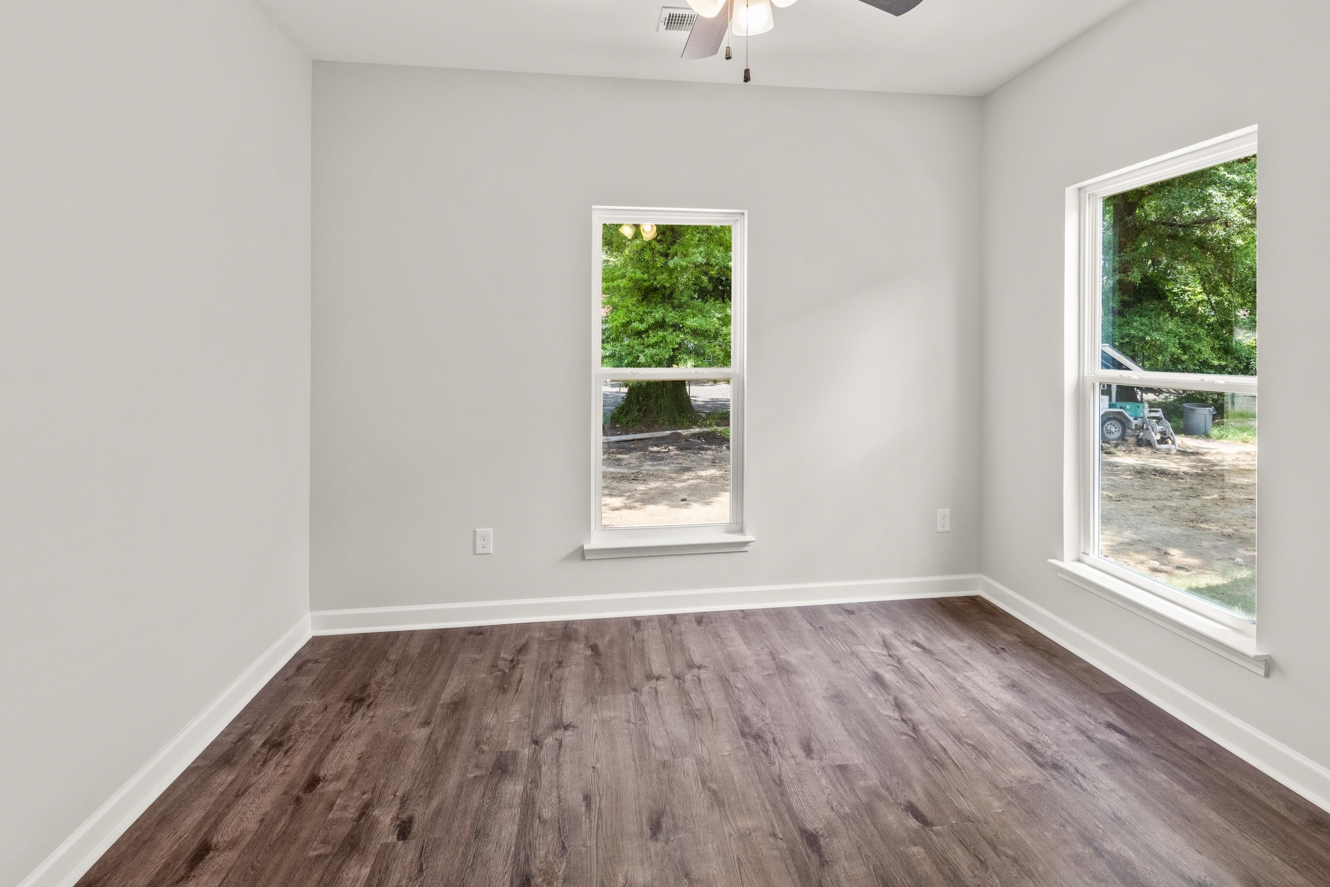 828 Semmes Street Memphis, TN 38111 - Photo 12 of 18 wooden floor in an empty room with a window