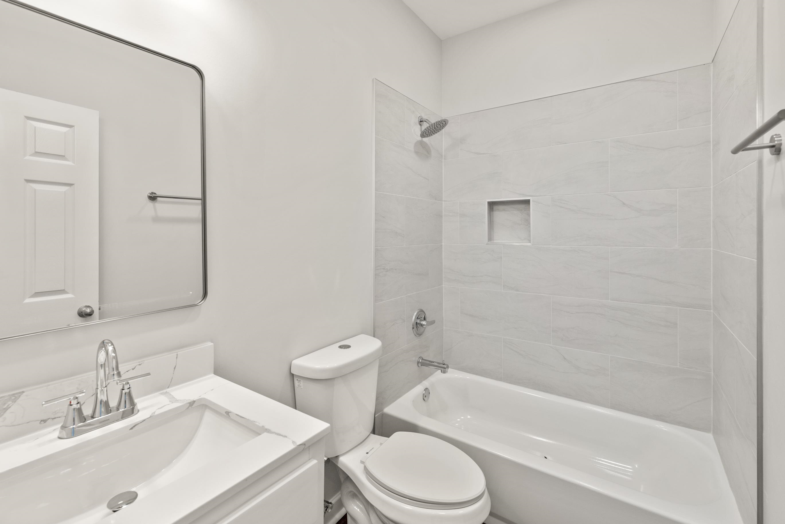 828 Semmes Street Memphis, TN 38111 - Photo 13 of 18 a bathroom with a sink toilet and shower