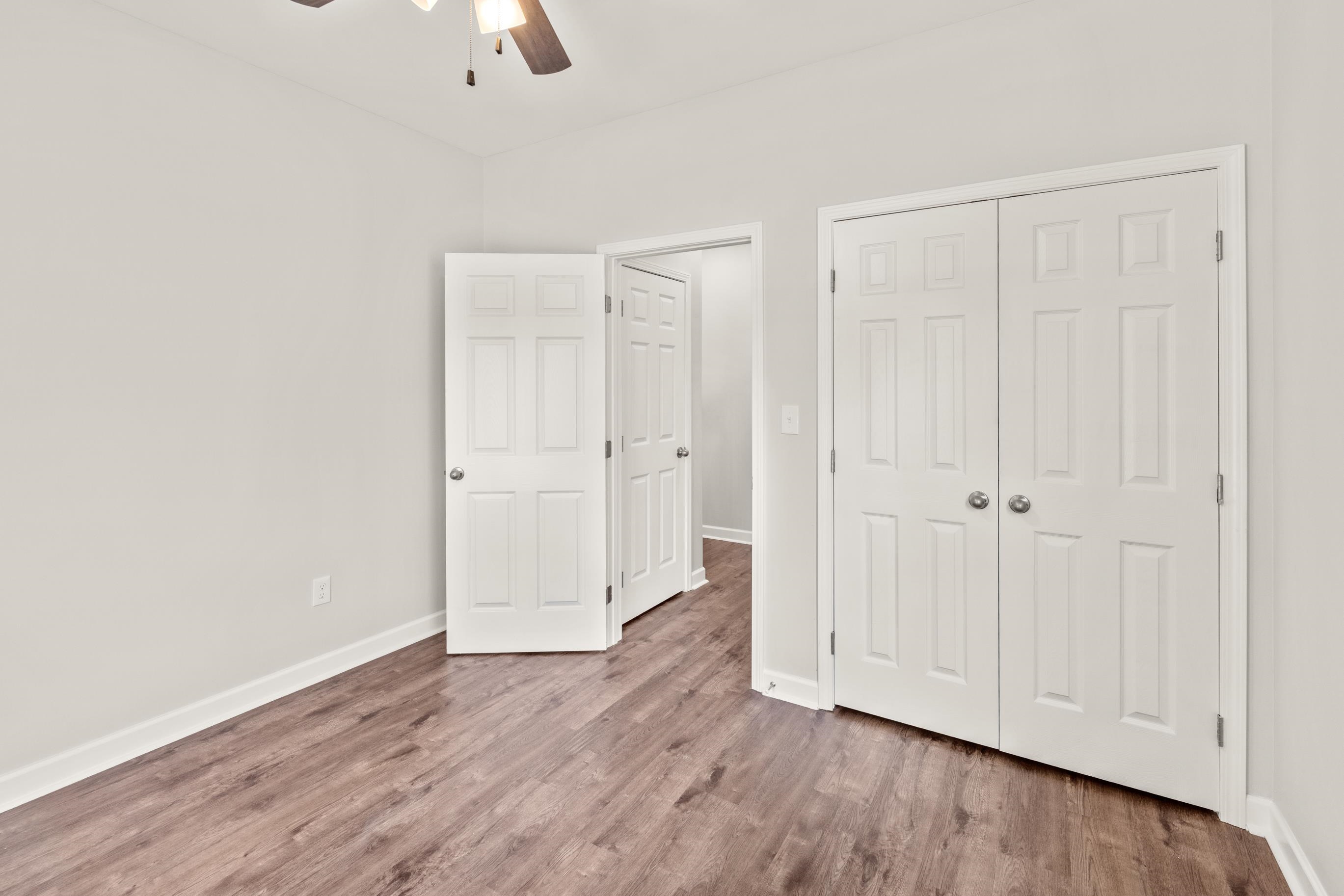 828 Semmes Street Memphis, TN 38111 - Photo 15 of 18 a view of an empty room with wooden floor
