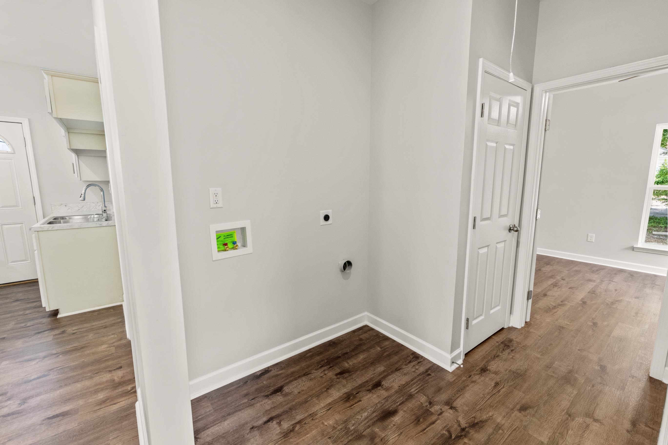 828 Semmes Street Memphis, TN 38111 - Photo 15 of 18 an empty room with wooden floor and windows