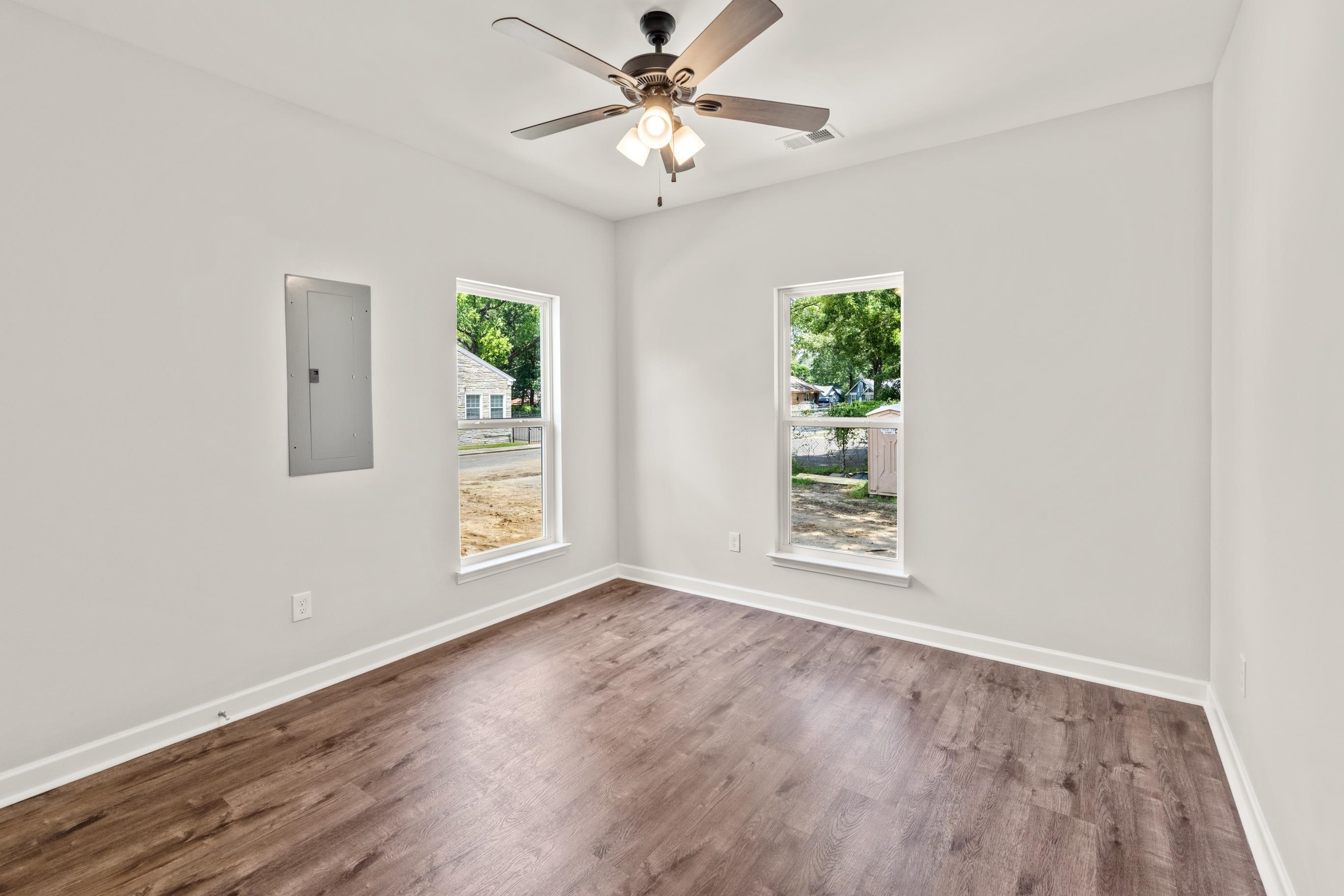 828 Semmes Street Memphis, TN 38111 - Photo 4 of 18 a view of an empty room with window and wooden floor