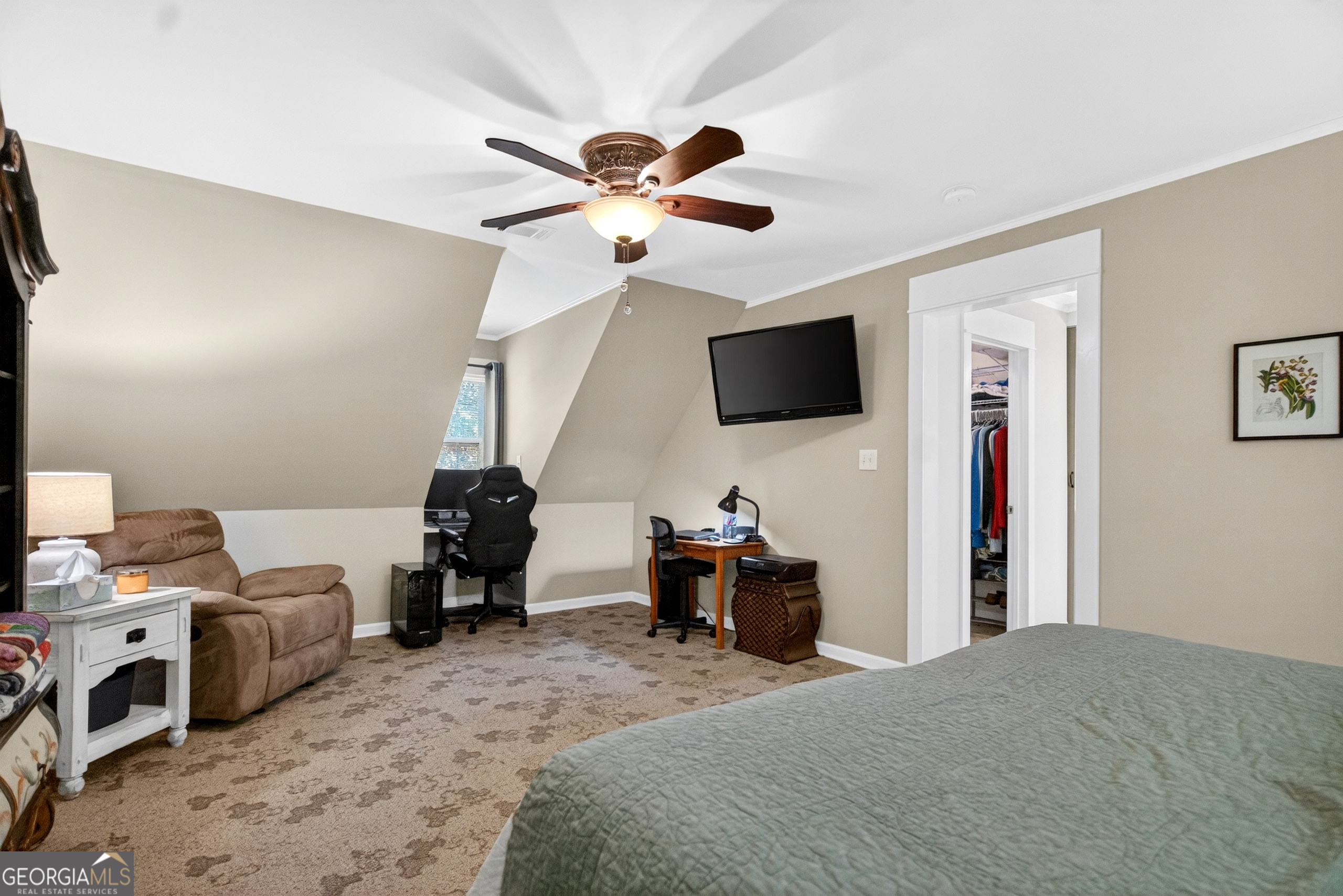 4656 Greenville Road LaGrange, GA 30241 - Photo 22 of 34 a bedroom with a bed and a flat tv screen on the dresser