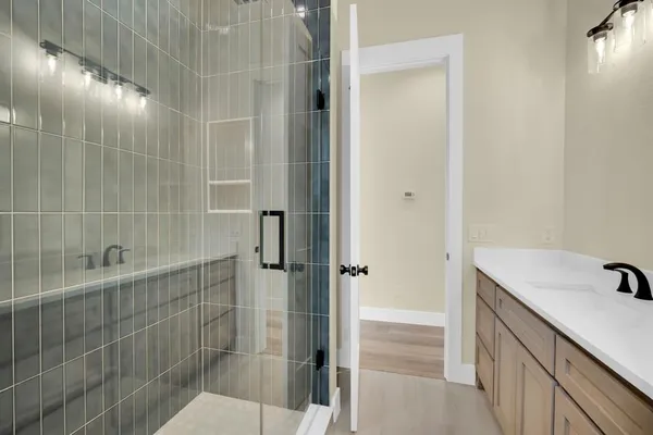 a bathroom with a sink and shower