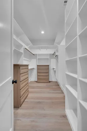 a view of an empty walk in closet