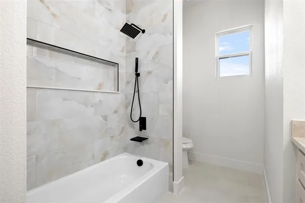 a bathroom with a bathtub and a shower