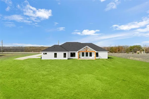 a view of a house with a big yard