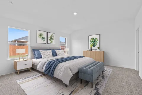 a bedroom with a bed and a painting on the wall