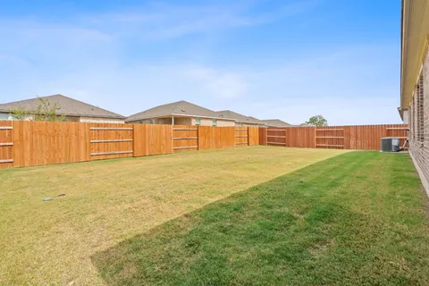 a view of an entrance to house with yard