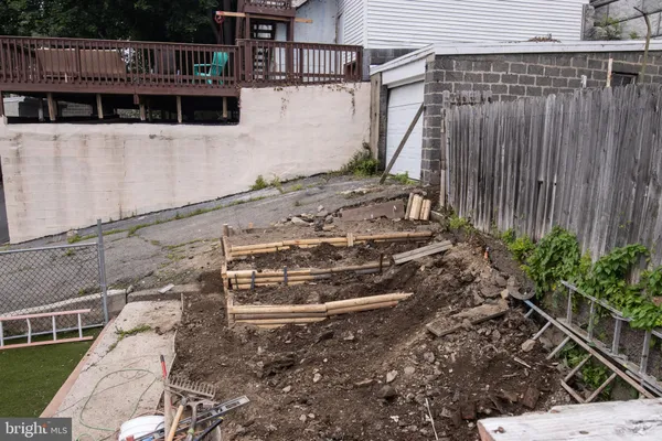 a view of a house with a wooden deck