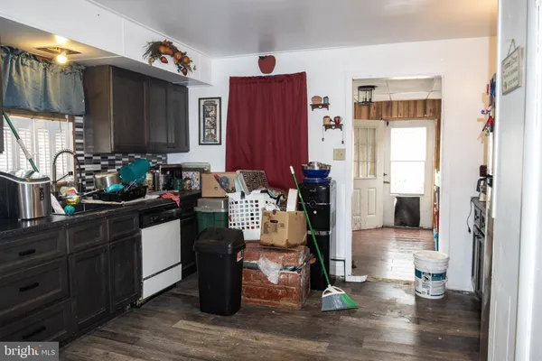 a kitchen with a refrigerator and a stove