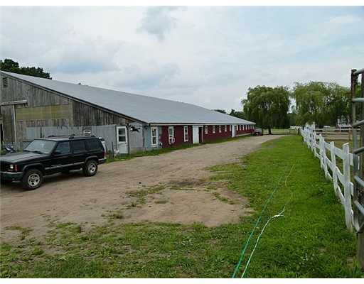2415 Tower Hill Road North Kingstown, RI 02874 - Photo 10 of 11 Exterior Front. This barn houese the indoor riding ring and horse stables as well as cartakes quarters, bathroom, tack room