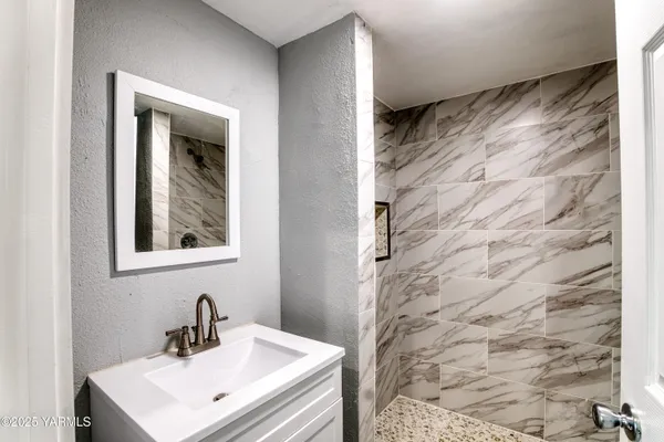 a bathroom with a sink and a mirror