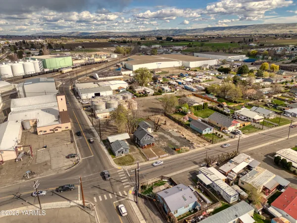 a view of a big room with wooden floor and furniture