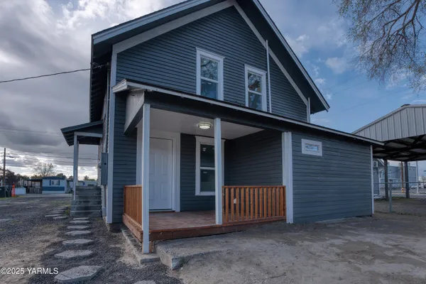 a front view of a house with a garage