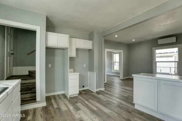 wooden floor in an empty room and a window