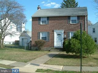 1030 Edgerton Road Secane, PA 19018 - Photo 1 of 5 a front view of a house with a yard