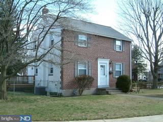 1030 Edgerton Road Secane, PA 19018 - Photo 3 of 5 a view of a brick house next to a yard