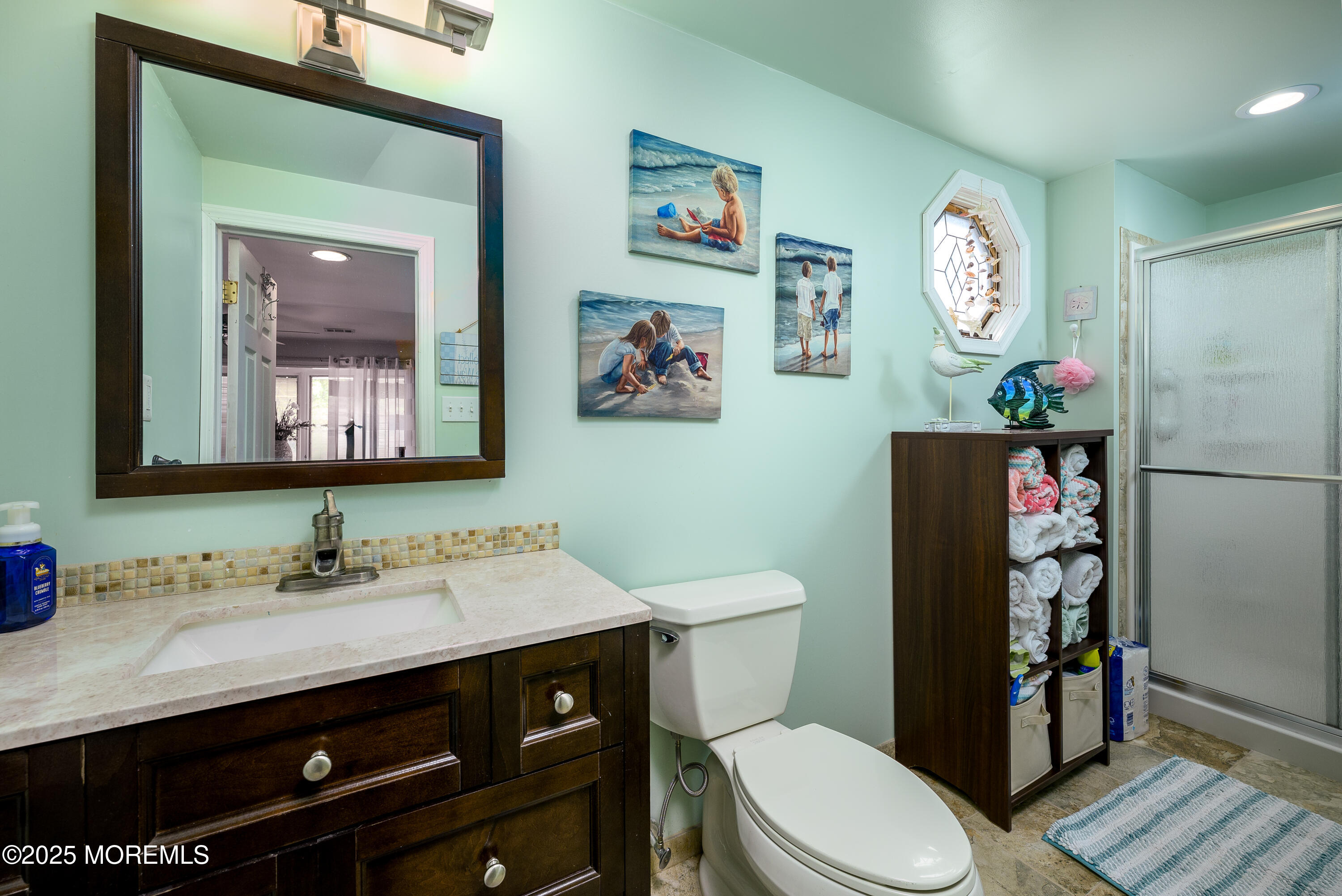 109 West Island Road Bayville, NJ 08721 - Photo 14 of 38 a bathroom with a toilet a sink and a mirror